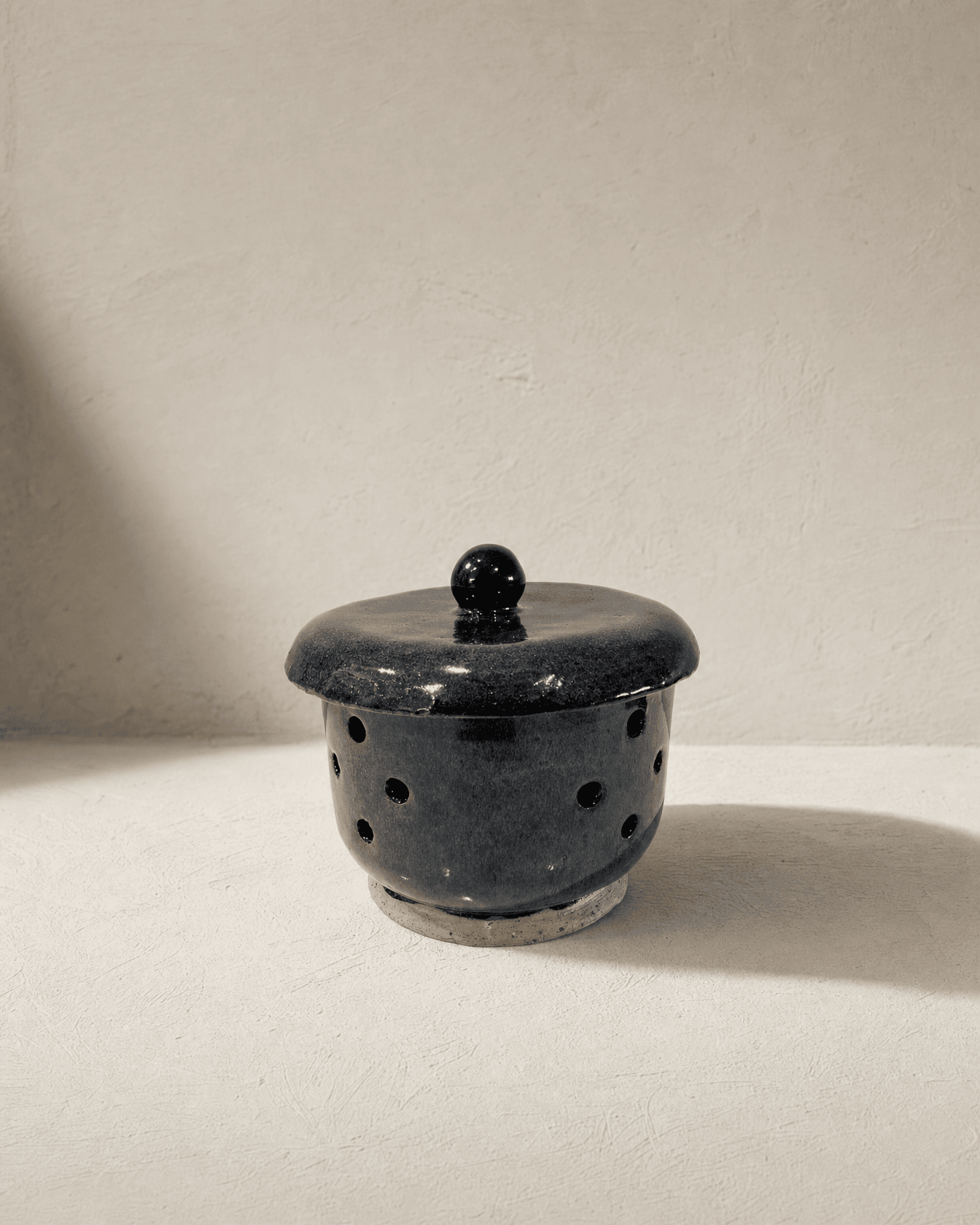 Oil burner, handmade stoneware, on the studio bench